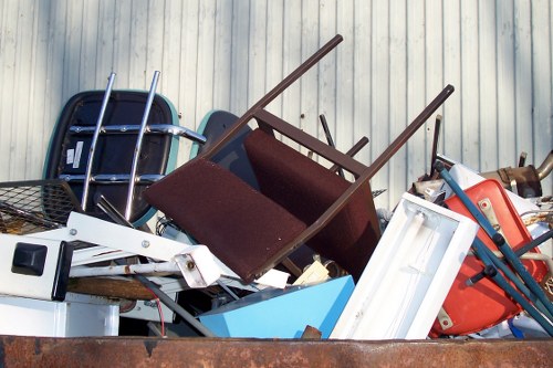 Trucks transporting cleared items from a Purley home.